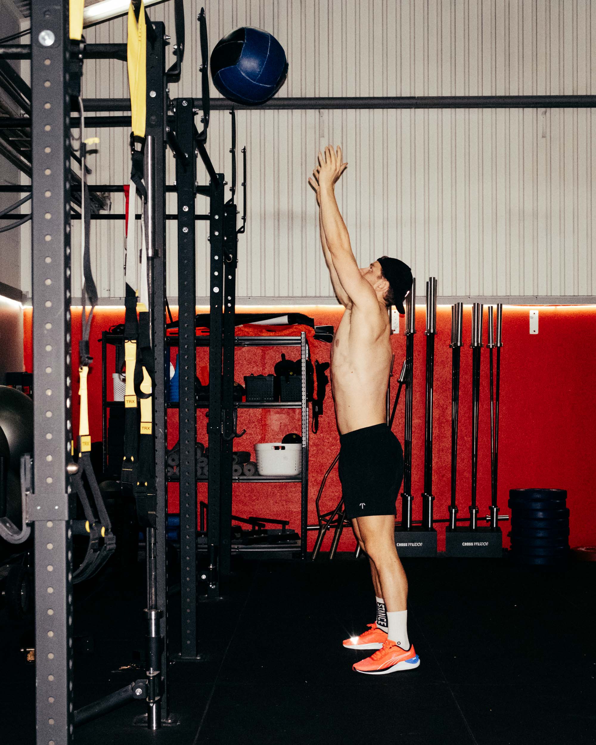 A man doing wall balls in TOQO shorts