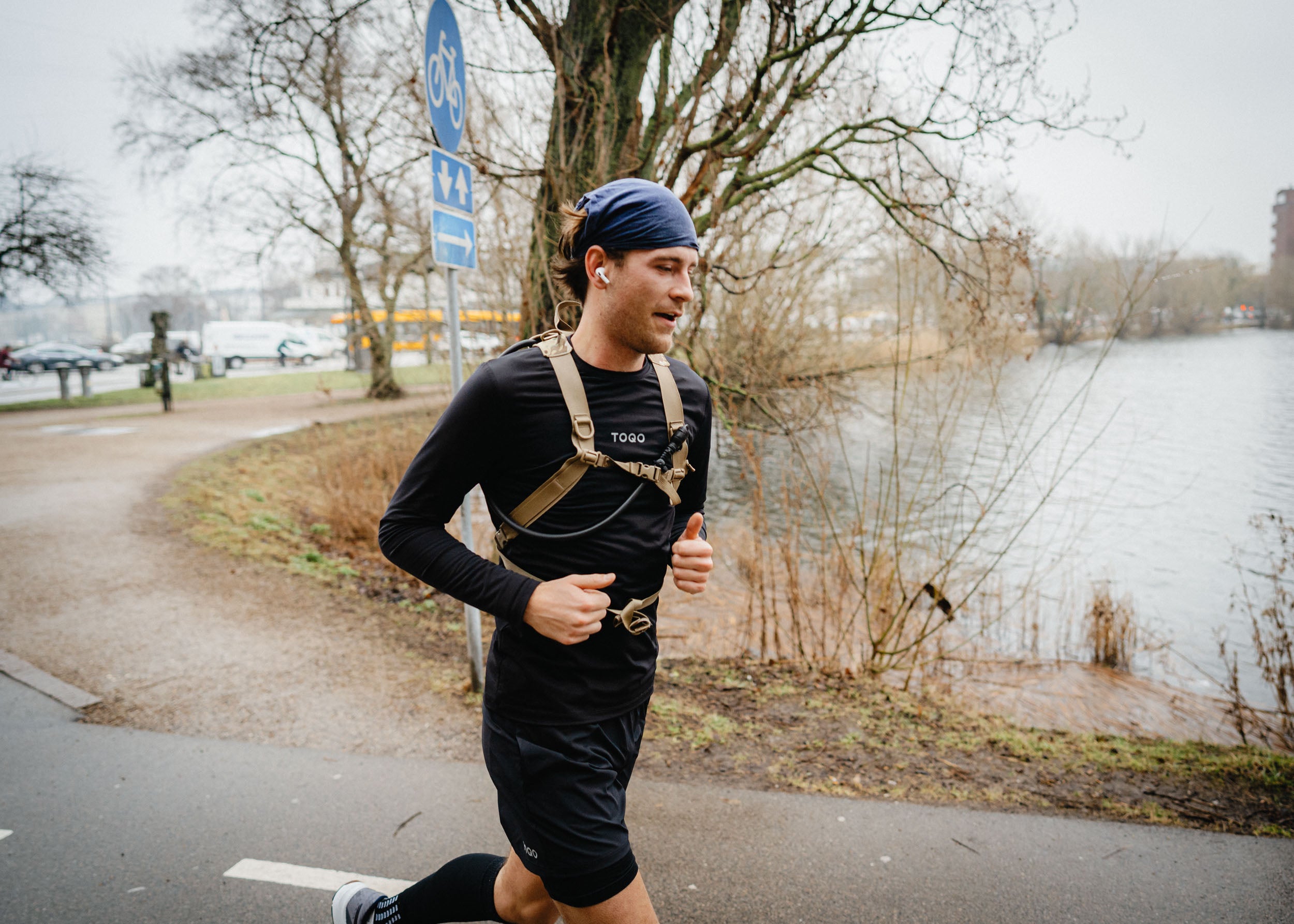A man running down the lakes in copenhagen.