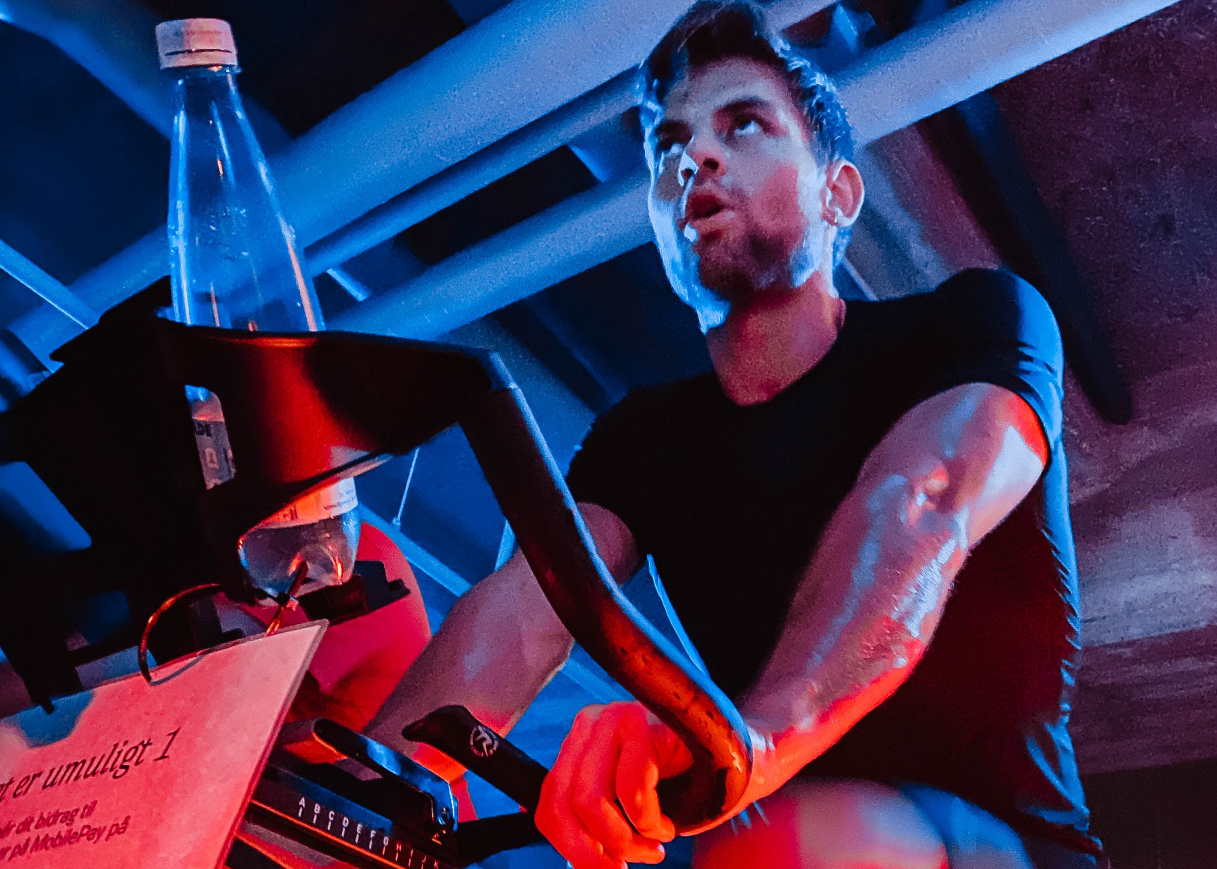 A guy cycling on a stationary bike