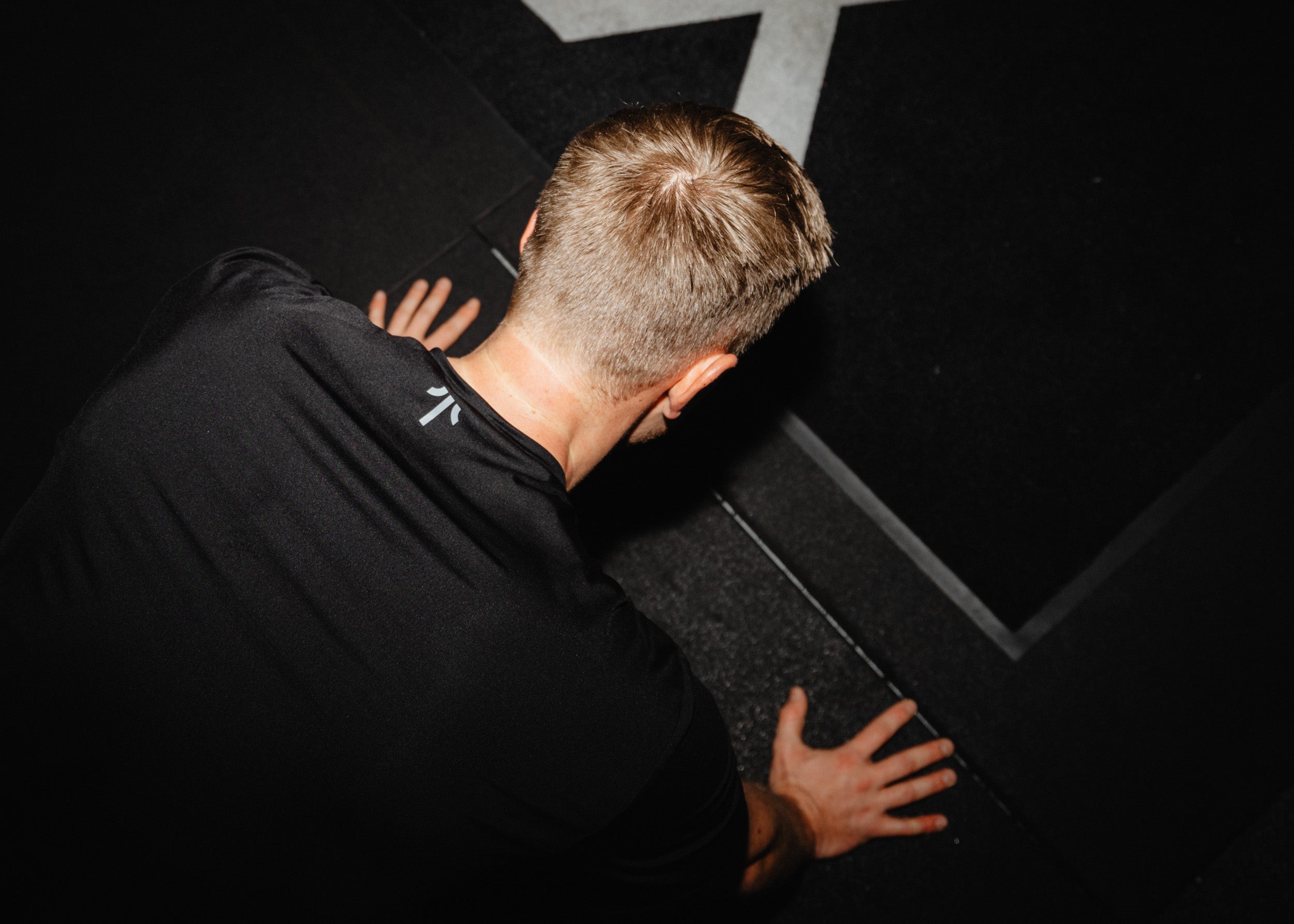 Man doing push ups in TOQO longsleeve