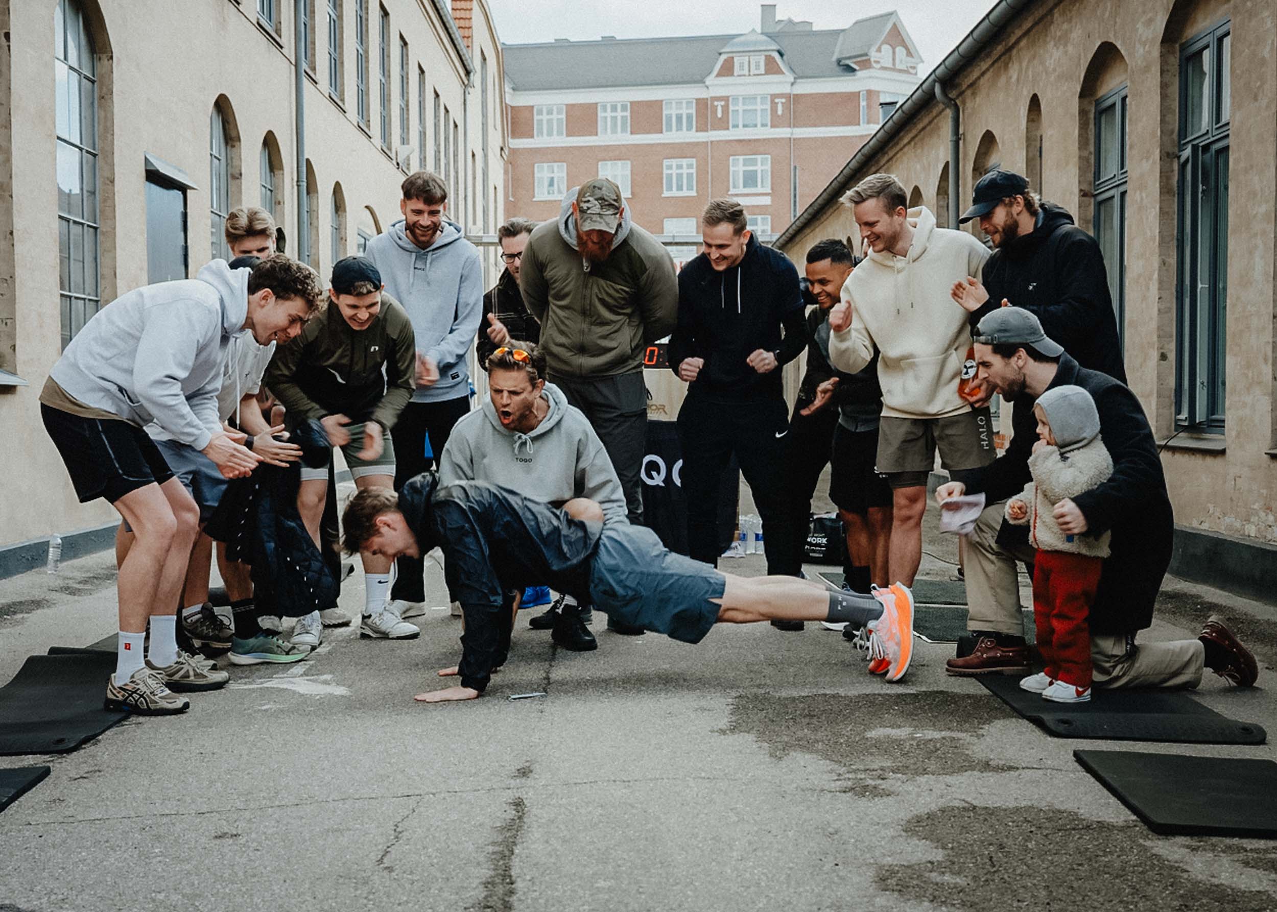 A group of men doing push ups