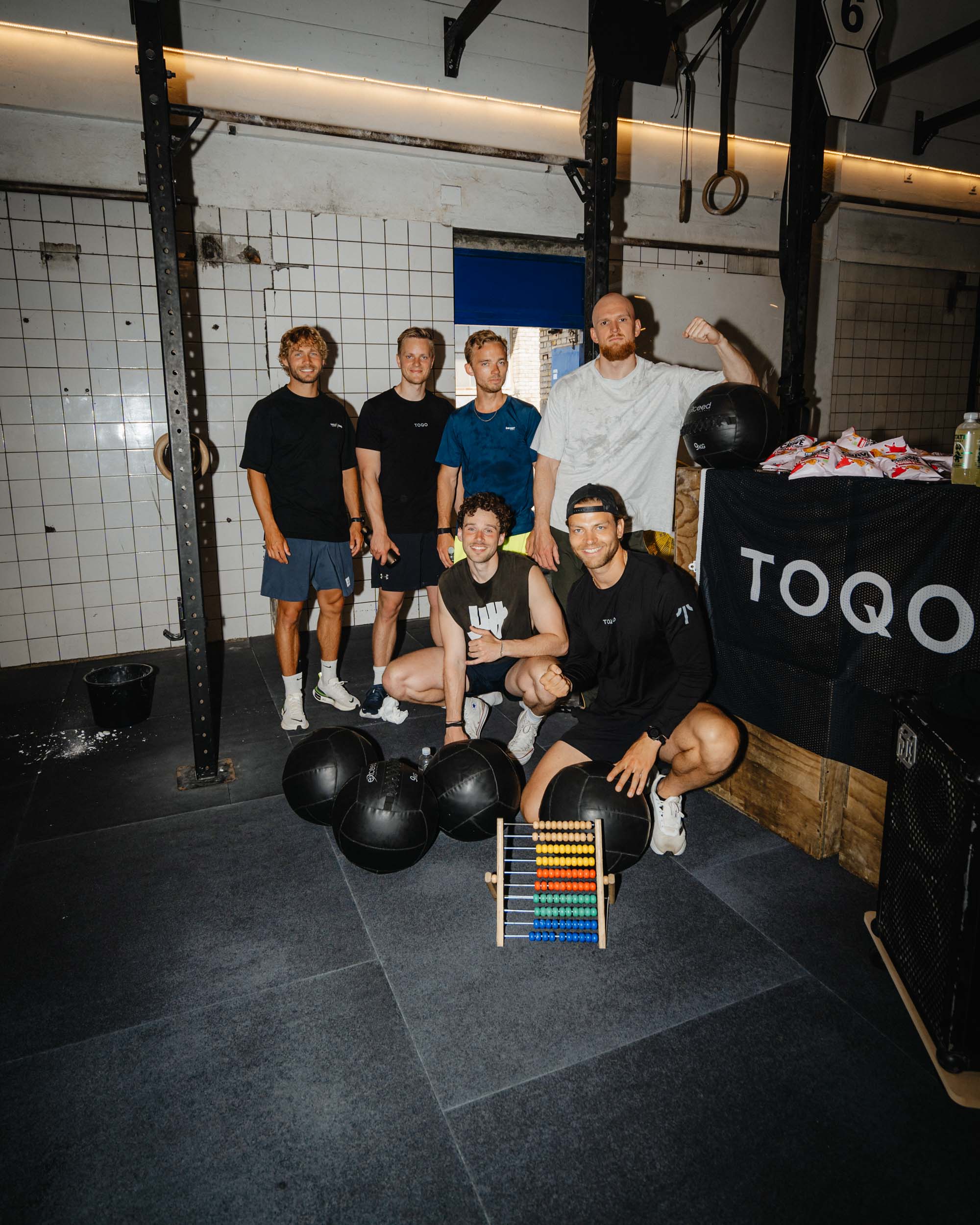A group of men doing wall balls